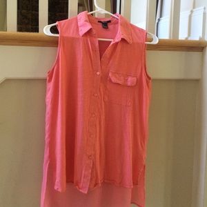 A coral tank top *top button missing*