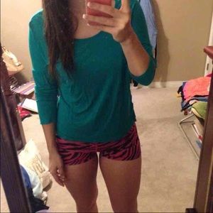 Turquoise 3/4 sleeve shirt with cut out on back.