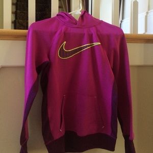A pink nike sweatshirt