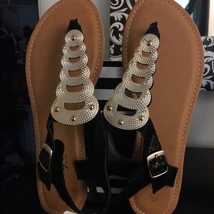 Black and gold sandals