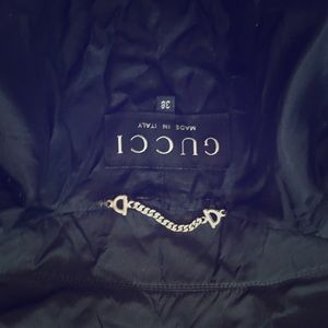 A Gucci trench rain coat