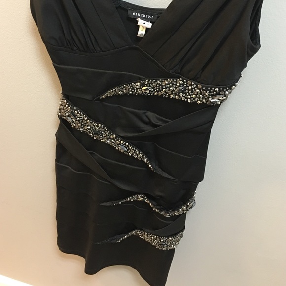 Nikibiki brand black dress with embellishments