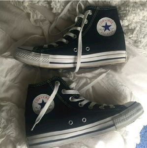 Black and white high tops converse