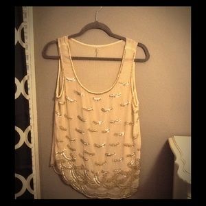 Gold sequin sheer top.