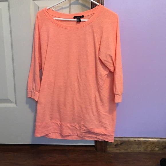 Salmon colored, quarter sleeved shirt
