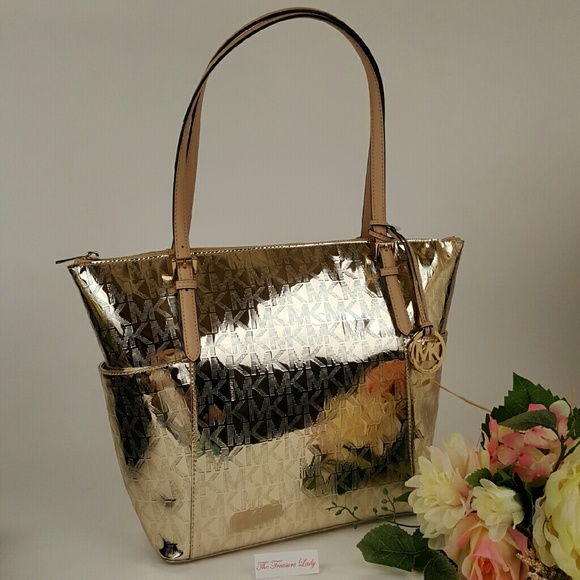 Michael Kors Handbags - Michael Kors Metallic Monogram Jet Set Gold bag