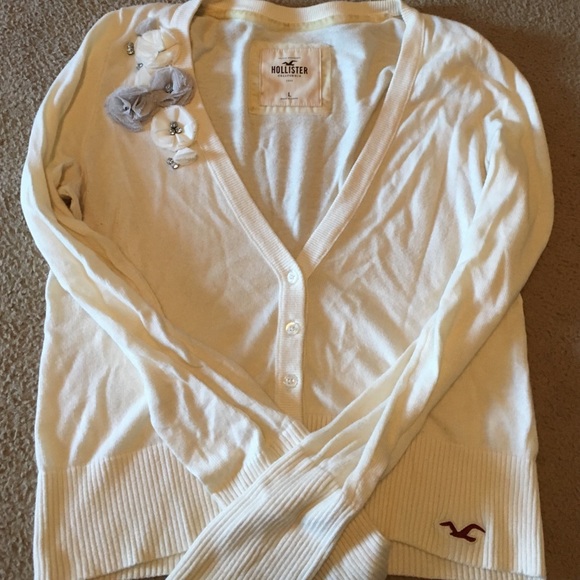Hollister sweater with rosettes and rhinestones