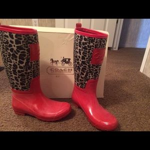 Red coach rain boots.
