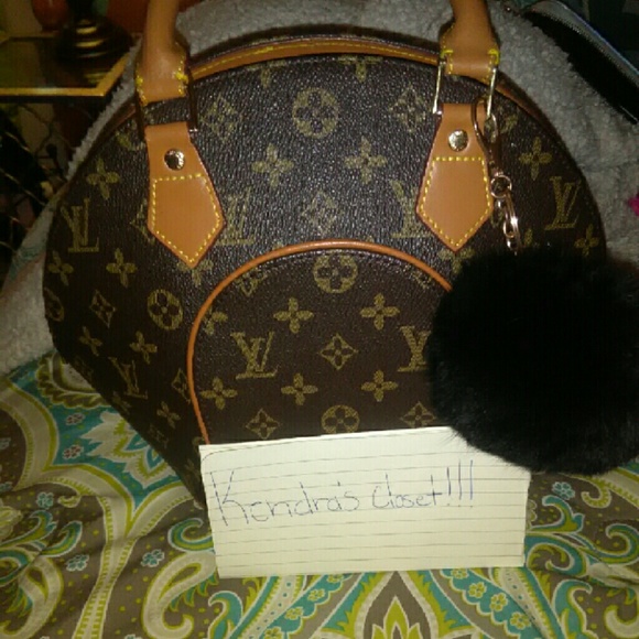 Lv bag /puff ball/ tassel