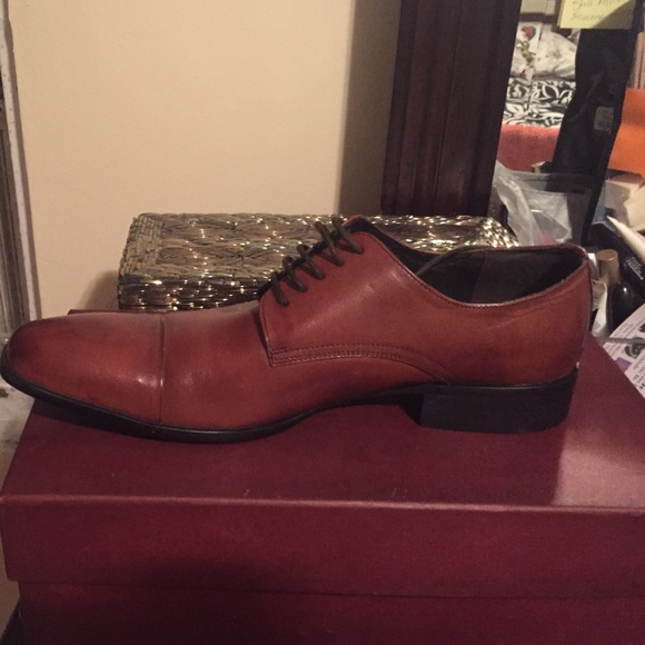 Brand new Kenneth Cole and never been worn .