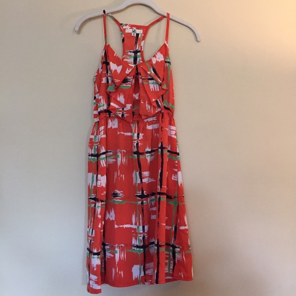 Orange dress with green, black, white design