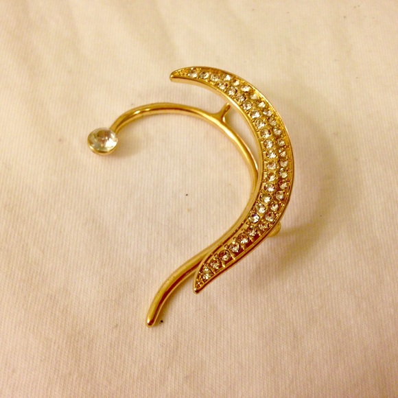 Gold metal ear cuff with gemstones