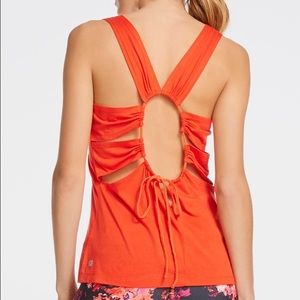 Fabletics orange work out top, semi open back.