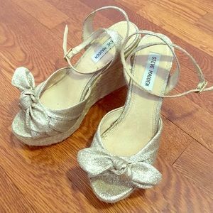 Women's glitter gold wedges.