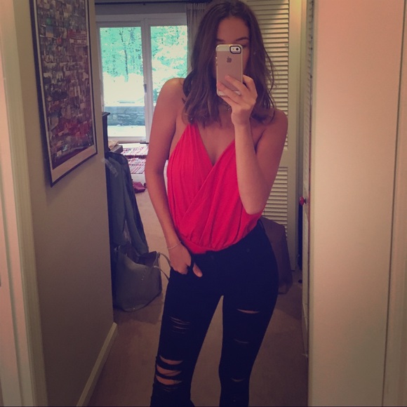 Red backless body suit.