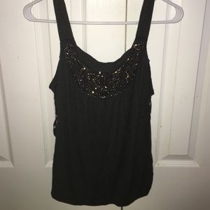 Gray top with beading on the neckline.