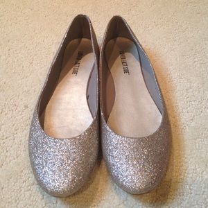 Glittery gold flats