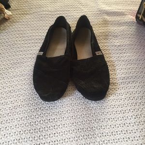 Black TOMs slip ons!