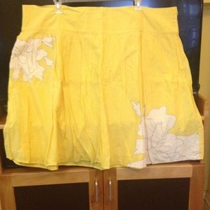 Yellow plus size skirt with white embroidery.