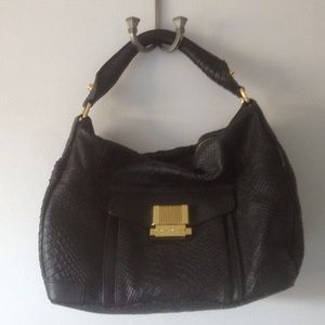 Black leather Trina handbag NWOT