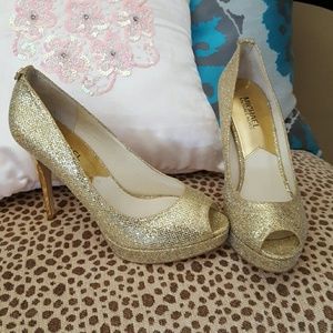Michael Kors gold pumps