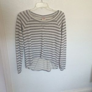 A white and grey striped sweater