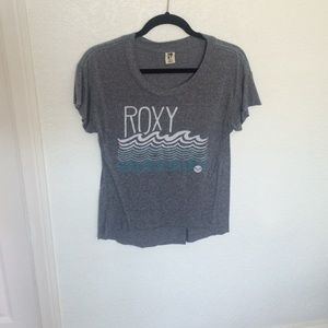 A grey heathered shirt with a roxy design