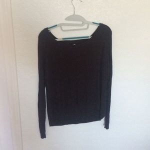 A darkgrey sweater with a triangle print knit in