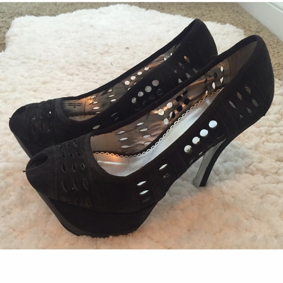 Bebe heels in black and silver bottoms