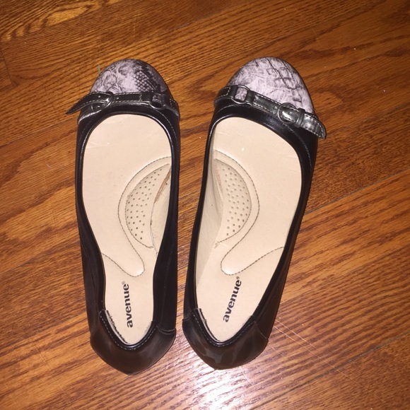 Black and grey buckled flats