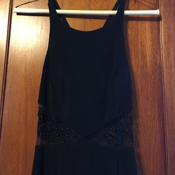 Black floor-length gown with lace cutout