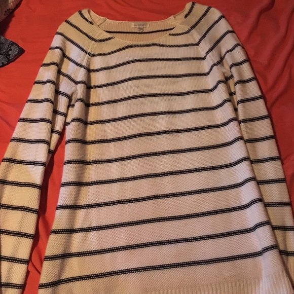 A black and white long sleeve sweater