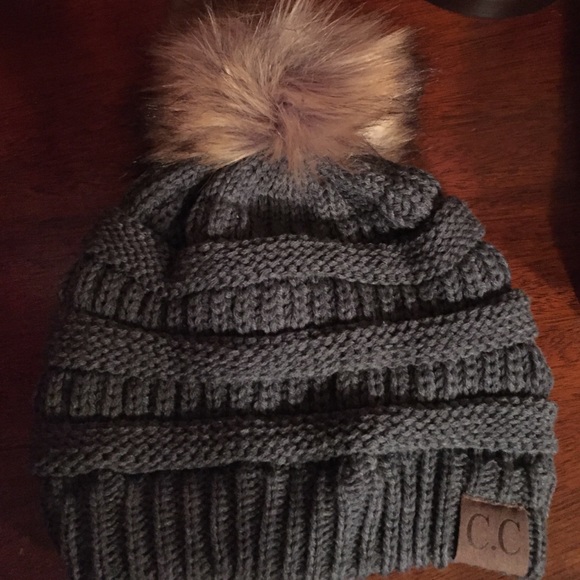 Beanie with faux fur topper. NWOT