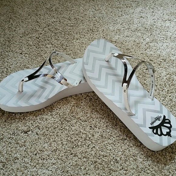 White and silver flip flops