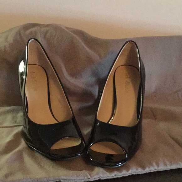 Black patent peep toe heels.