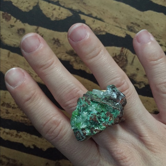 Green gem mineral with gold and ceramic ring
