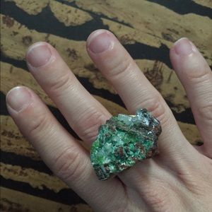 Green gem mineral with gold and ceramic ring