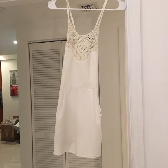 White romper with high neck detailing