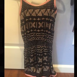 Pink, white, and black romper