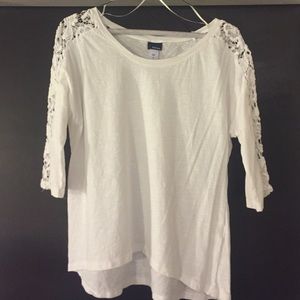 White asymmetrical top with crochet sleeve inset