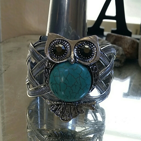 Turquoise and silver colored owl cuff bracelet