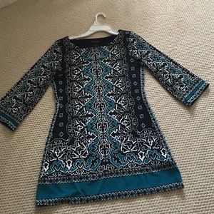 A size medium White House black market tunic.