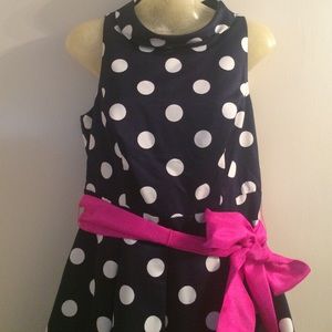 Navy and white polka dot dress with pink bow