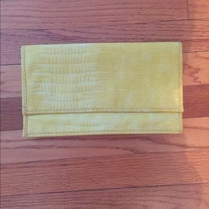 Bright yellow faux leather clutch