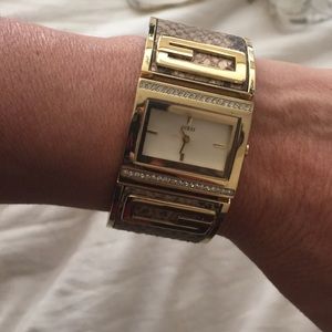 Guess gold  with snake skin watch