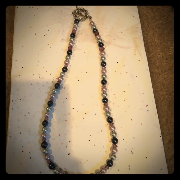Unique handmade purple necklace with Bird closure