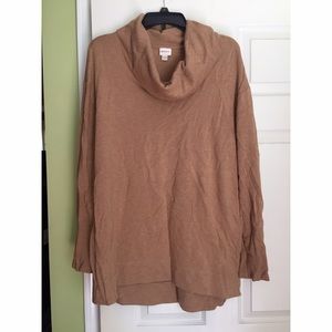 Tan tunic.