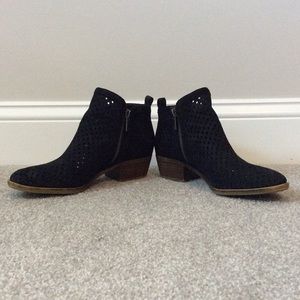 Classic black perforated ankle bootie.
