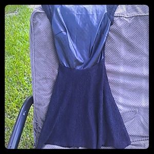 Black lace dress with fake leather bodice.