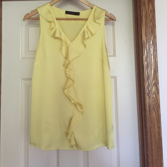 Yellow frilly sleeveless blouse